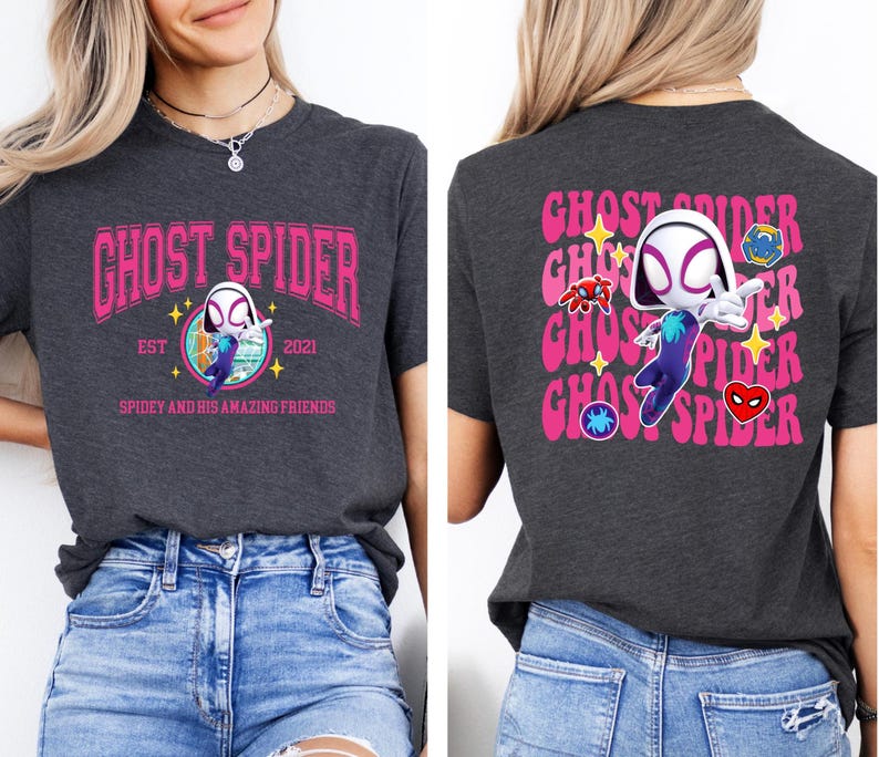 a woman wearing a gray t-shirt with a graphic design of a character resembling Spider-Man.