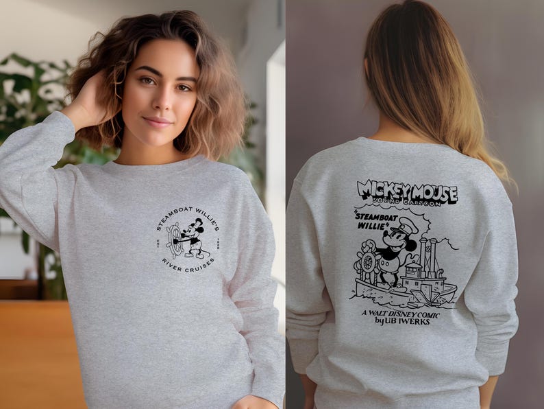 May include: A gray sweatshirt with a black and white illustration of Mickey Mouse on a steamboat. The text "Mickey Mouse Sound Cartoon" is above the image and "Steamboat Willie" is below the image. The text "A Walt Disney Comic by UB Iwerks" is at the bottom of the image.