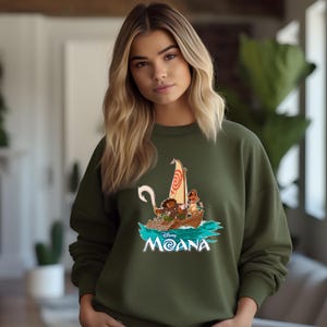 May include: A white ceramic mug with a black handle and the text "But First, Coffee" in a black, handwritten-style font. The mug is on a white surface.