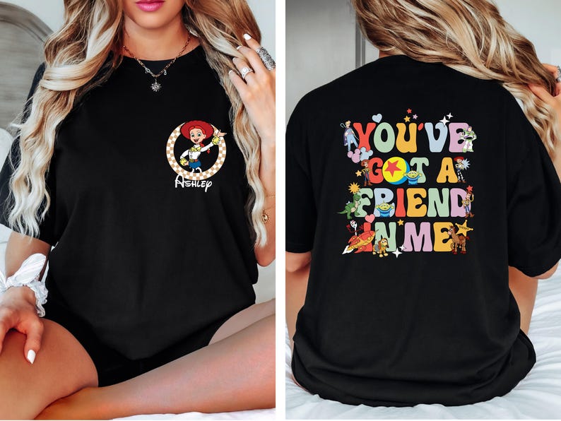 May include: Black t-shirt featuring a cartoon image of Jessie from Toy Story with the name "Ashley" below. The back of the shirt has the phrase "You've Got A Friend In Me" with various Toy Story characters.
