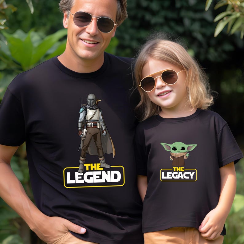 a man and a little girl wearing star wars t - shirts