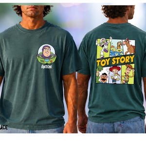 A man wearing a green t-shirt with a cartoon character and the text "TOY STORY" printed on the back.