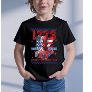 May include: Black t-shirt featuring a graphic of Spider-Man with a patriotic design. The design includes the text "1776", "United States", and "Independence Day" in red and white, with a blue and white American flag.