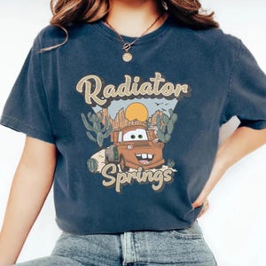 a woman wearing a shirt that says radiator springs