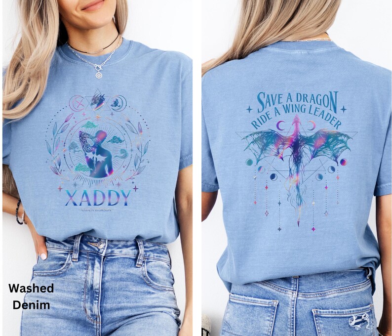 May include: A light blue t-shirt with a graphic design of a person with wings and the text "XADDY" on the front. The back of the shirt has a graphic design of a dragon with the text "Save a Dragon + Ride a Wing Leader".