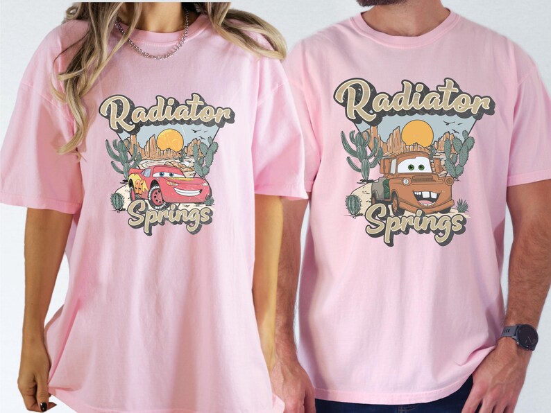 a man and a woman wearing pink shirts