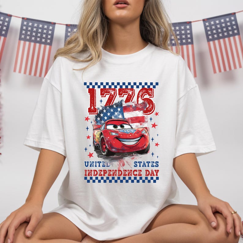A woman wearing a white t-shirt with a graphic of a red car and an American flag, along with the text "1776 UNITED STATES INDEPENDENCE DAY".