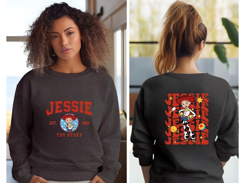May include: Dark gray sweatshirt featuring the name "JESSIE" in red block letters with a cartoon image of Jessie from Toy Story. The back of the sweatshirt displays a larger graphic of Jessie with the name "JESSIE" in a retro design.