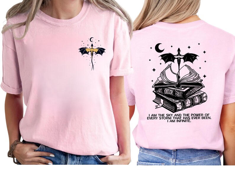A woman wearing a pink t-shirt with a dragon and a quote printed on the back.