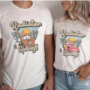 a man and a woman wearing matching shirts