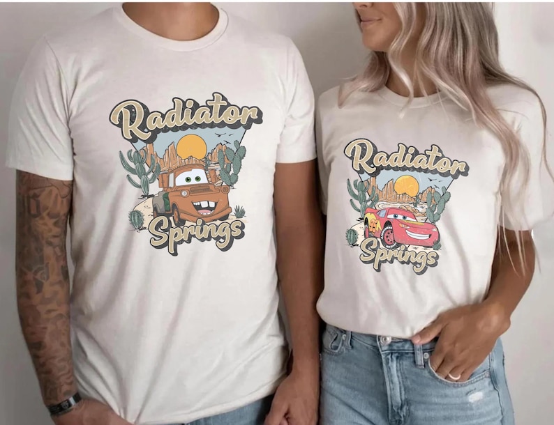 a man and a woman wearing matching shirts