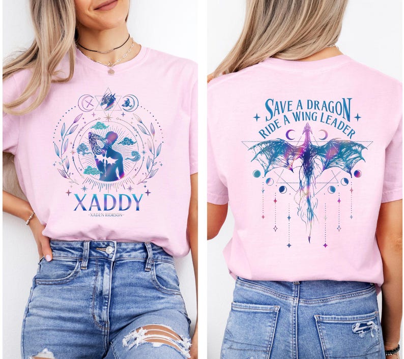 May include: Pink t-shirt with a graphic design of a woman with wings and the text "XADDY" on the front. The back of the shirt has a graphic design of a dragon with the text "Save a Dragon, Ride a Wing Leader".