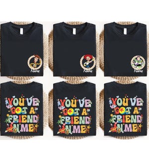 May include: Six black t-shirts featuring characters from the movie Toy Story. The top row has character portraits with the name "Name" below. The bottom row has the phrase "You've Got A Friend In Me" in colorful letters.