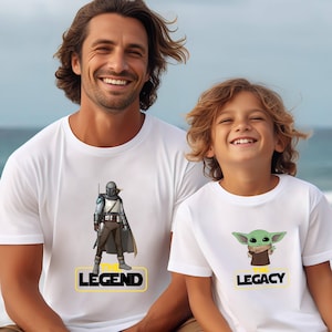 a man and a child wearing star wars t - shirts