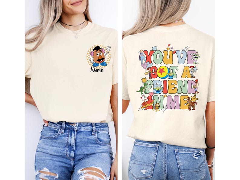 May include: Cream-colored t-shirt featuring a Mr. Potato Head graphic with the word "Name" below it. The back of the shirt displays the phrase "You've Got A Friend In Me" with various cartoon characters.