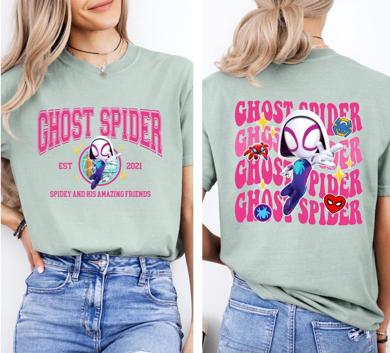 a woman wearing a green t-shirt with a graphic design of a character resembling Spider-Man.