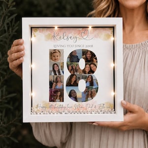 May include: A square white shadow box frame with internal LED lights containing a personalized collage. The design features the name Kelsey, the text Loving You Since 2008, and a large number 18 formed by multiple photographs of a person.
