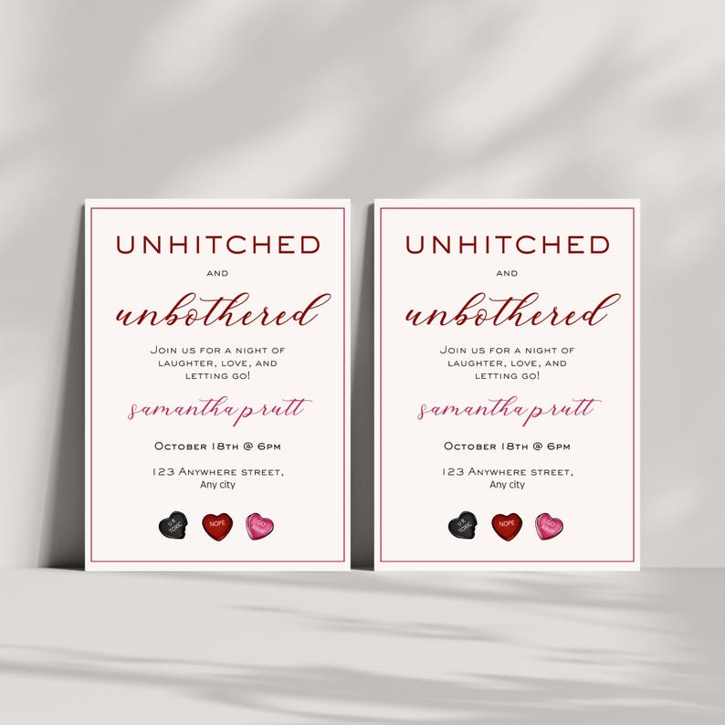 May include: Two white cards with a burgundy border and text that reads "Unhitched and Unbothered". The text is in a burgundy font. The cards also include the date "October 18th @ 6pm", an address, and the name "Samantha Prutt". The cards are decorated with three small heart-shaped sweets, one black and two red.