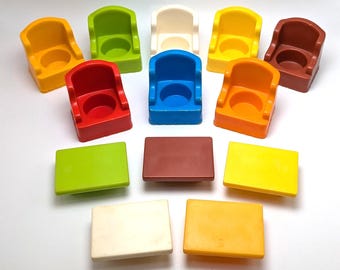May include: A set of ten colorful plastic chairs and tables for children. The chairs are in various colors, including red, blue, yellow, green, and white. The tables are in brown and yellow.