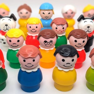 May include: A collection of vintage plastic figurines, including people, animals, and a few wearing glasses. The figurines are in various colors, including red, blue, green, yellow, and orange.