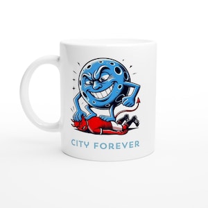 May include: White ceramic mug featuring a cartoon illustration of a blue, grinning moon character standing over a red devil figure. The text "CITY FOREVER" is printed in light blue below the illustration.