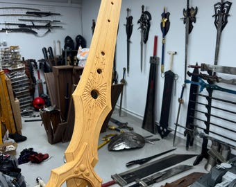 May include: A wooden sword with intricate carvings and a circular design on the blade. The sword is held in a hand, with other swords and shields visible in the background.