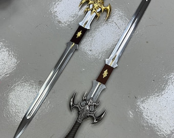 May include: Two decorative swords with ornate handles and silver blades. The swords have intricate designs on the handles, including a skull and wings. The blades are sharp and pointed.