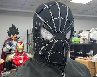 May include: A black and white Spider-Man mask with a mesh eye covering. The mask is made of a soft, flexible material and has a detailed design.