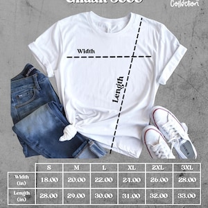 May include: White Gildan 5000 t-shirt with size chart, jeans, and white sneakers. The shirt has measurements for width and length in inches, ranging from 18 to 28 inches wide and 28 to 33 inches long. The Lupita Collection logo is visible.