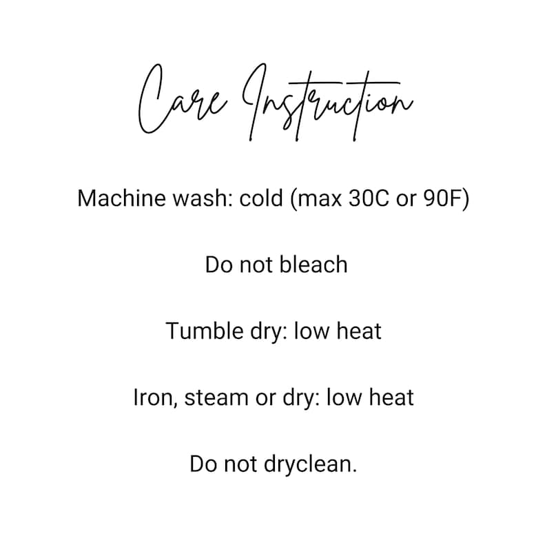 May include: White background with black text detailing care instructions. The text includes: machine wash cold (max 90F), do not bleach, tumble dry low heat, iron steam or dry low heat, and do not dry clean.