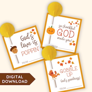 May include: Three square paper gift tags with yellow lollipops inserted. Each tag features autumn leaf illustrations and text: God's love is POPPIN', so thankful GOD made you!, and GOBBLE UP God's goodness!, with a FROM line for writing names.