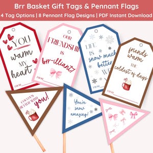 May include: Gift tags and pennant flags with winter-themed designs. The tags have phrases like "You warm my heart" and "Our friendship is brilliant!" The pennants say "Cocoa's better with you!" and "You're snow amazing!"