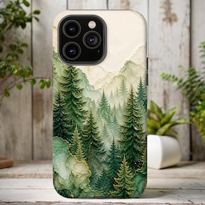 May include: A phone case featuring a forest scene with green and gold accents. The design includes detailed evergreen trees and a misty mountain backdrop. The case has a glossy finish and a camera cutout.