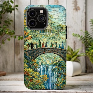 May include: A phone case with a stained-glass effect design. The image shows figures crossing a stone bridge, with a waterfall and a building in the background. The case has a glossy finish and features a vibrant, detailed illustration.