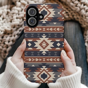 May include: A phone case featuring a geometric pattern in shades of brown, blue and white. The case has a cut-out for the camera lens.