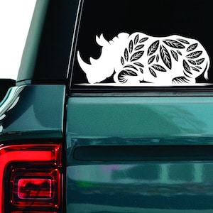 Sticker neushoorn bloemen, sticker neushoorn, sticker magische neushoorn, sticker mythische neushoorn in bloemen, sticker autoruit boho dieren in het wild