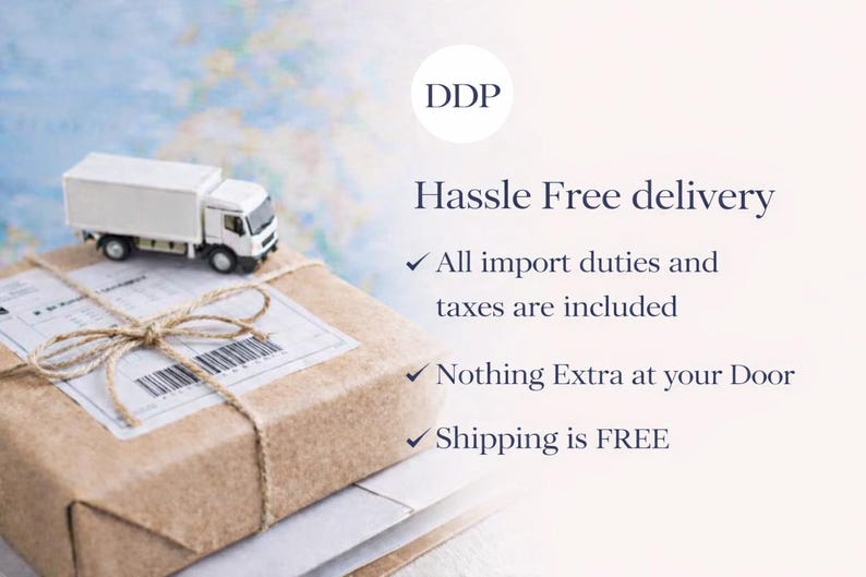 May include: A miniature white delivery truck sits atop a wrapped package tied with twine. The text reads "Hassle Free delivery" with bullet points indicating all import duties and taxes are included, nothing extra at your door, and free shipping.