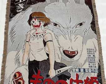 May include: A tapestry featuring a white wolf with a young woman standing in front of it. The woman is holding a sword and has a red and white face paint. The tapestry has Japanese text that reads "生きもの の け姫" and "宮崎駿監督作品".