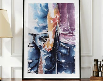 May include: A framed watercolor painting depicting two figures standing side by side, wearing blue jeans and shirts in shades of blue and purple. The artwork features visible brushstrokes and color blending, capturing the lower torsos of the figures.