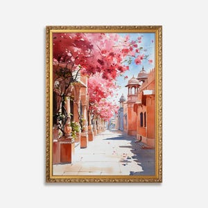 Könnte beinhalten: Ein Aquarellgemälde einer schmalen Straße, die von rosa blühenden Bäumen und Gebäuden mit gewölbten Durchgängen gesäumt ist. Die Gebäude sind in Orange- und Rosatönen gestrichen, und die Straße ist mit Stein gepflastert.