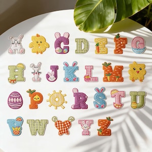 May include: Embroidered alphabet patches with Easter-themed designs. Each letter features a unique design, including bunnies, chicks, carrots, and Easter eggs. The patches are in various colors, perfect for crafting and personalization.