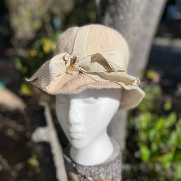 Cream wool felt hat with grosgrain ribbon and tiny amber crystal beetle pin