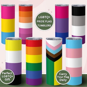 May include: Set of ten stainless steel tumblers with different pride flag designs. The tumblers are all the same size and shape, and they are arranged in two rows of five. The text "LGBTQ+ Pride Flag Tumblers" is written in a white circle at the top of the image. The text "Perfect LGBTQ+ Gift" is written in a white circle at the bottom left of the image. The text "Carry Your Flag Daily" is written in a white circle at the bottom right of the image.