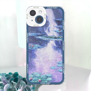 May include: A phone case featuring a Claude Monet painting of water lilies in shades of blue, purple, and green. The case has a blue border with "CLAUDE MONET" and "ART LIFE" printed on it.