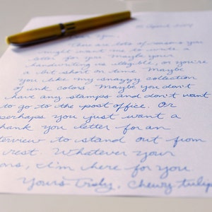 May include: A handwritten note on white paper with blue ink. The note reads, "There are lots of reasons you might want me to write a letter for you. Maybe your handwriting is illegible, or you're a bit short on time. Maybe you like my snazzy collection of ink colors. Maybe you don't have any stamps and don't want to go to the post office. Or perhaps you just want a thank you letter for an interview to stand out from the rest. Whatever your reasons, I'm here for you. Yours Truly, Chewy Tulip."