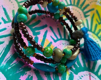 beaded wrap bracelet with hand-painted beads in teal and green, includes a tassel, wood, and glass with a funky vibe