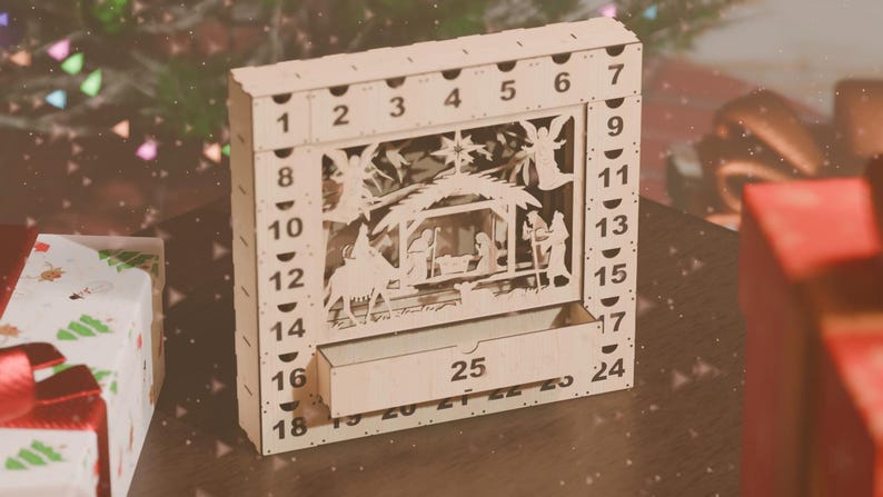 Light-colored wooden nativity advent calendar with number 25 drawer slightly open, surrounded by wrapped gifts.