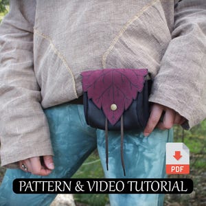 May include: A black leather pouch with a burgundy leaf-shaped flap, fastened with a gold button and leather ties. The pouch is worn at the waist. The text "PATTERN & VIDEO TUTORIAL" is displayed at the bottom.