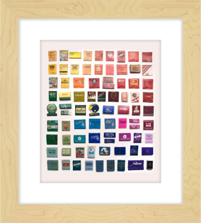 May include: A collection of vintage matchboxes arranged in a rainbow pattern. The matchboxes feature various designs and colors, including red, blue, green, yellow, and purple. Some matchboxes have logos or text, while others have images.