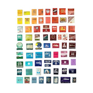 May include: A collection of vintage matchbook covers arranged in a rainbow pattern. The matchbooks feature various designs and logos, including a hotel, a restaurant, a bar, and a gas station. The matchbooks are all in different colors, including red, orange, yellow, green, blue, purple, and pink.